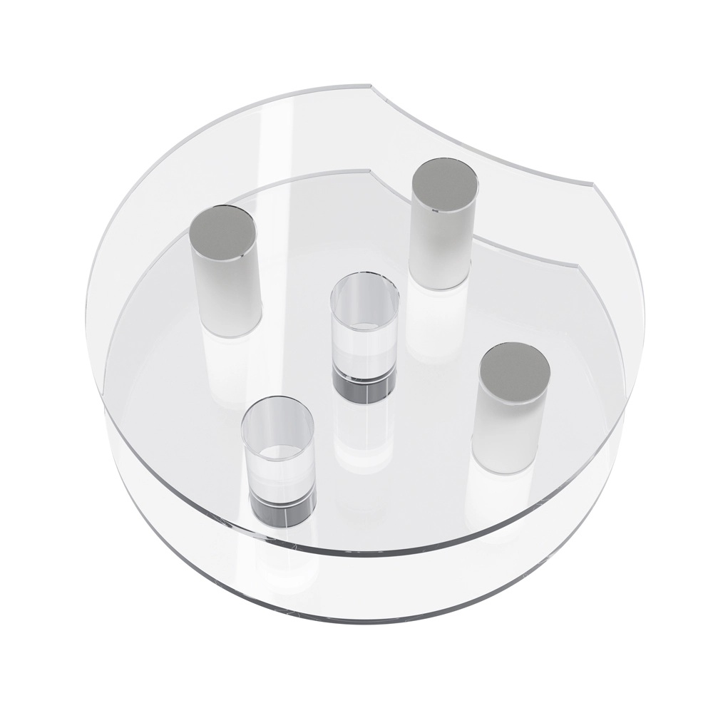 The part consists of two transparent plastic discs with one edge cut off, forming an Oreo-like top and bottom, and inside there are five cylindrical elements made of different plastics, arranged vertically in the shape of a cross.